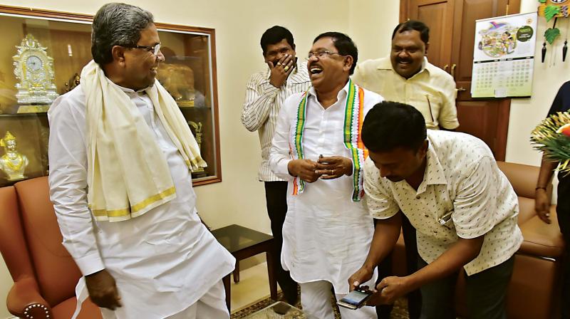Dr G Parameshwar with CM Siddaramaiah after submitting his resignation letter in Bengaluru on Thursday.