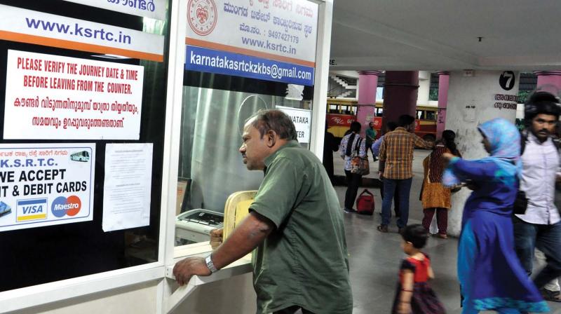 A passenger at the counter of Karnataka state RTC when it opened in the evening after the day-long strike by KSRTC employees in Kozhikode on Saturday. (Photo: DC)