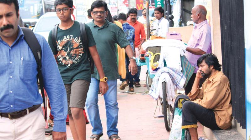 Anumuthu Chinnaraj (far right) on a street in Thiruvananthapuram.