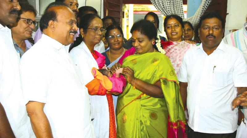 BJP state President Dr Tamilisai Soundararajan presents a gold ring to a new born baby on Monday as part of the 68th birthday celebrations of Prime Minister Narendra Modi.
