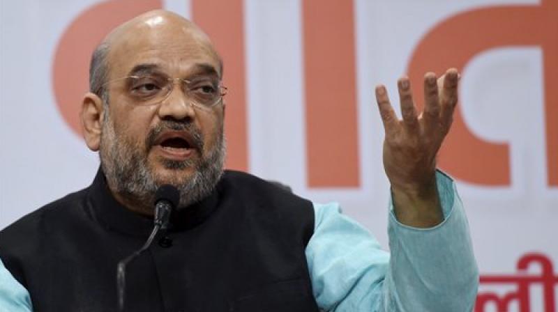 BJP President Amit Shah addressing a press confrence after completing 3 years of NDA government during the press preview in New Delhi on Friday. (Photo: PTI)