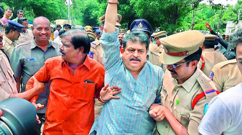 Police detain BJP MLC N. Ramachandra Rao along with activists from right-wing organisations during a protest against the externment of Swami Paripoorananda from the city.