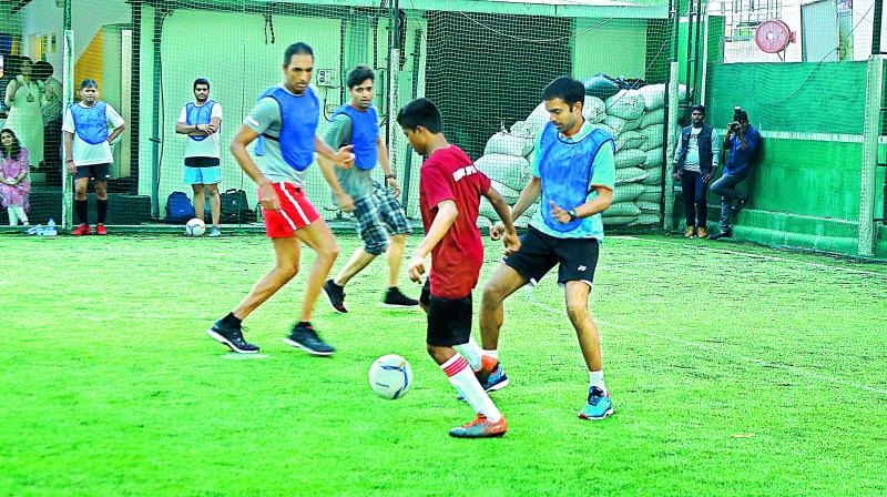 The Titans team in action against the Soccer Stars.