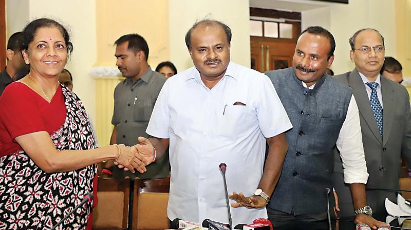 Defence Minister Nirmala Sitharaman with Chief Minister H.D. Kumaraswamy in Bengaluru on Saturday 	DC