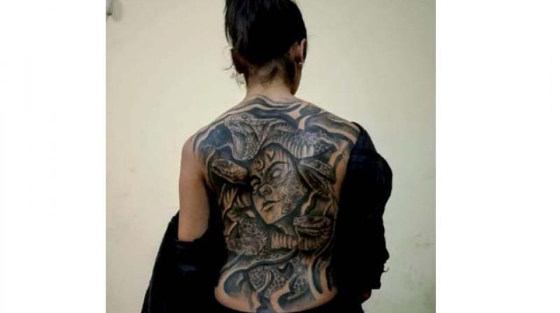 Neha has a tattoo of Medusa on her back.