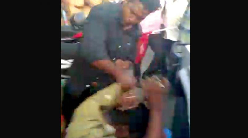 TV grab if Namm Tamilar Katchi worker attacking a policeman at NTK rally against IPL match on Tuesday.(Photo: DC)