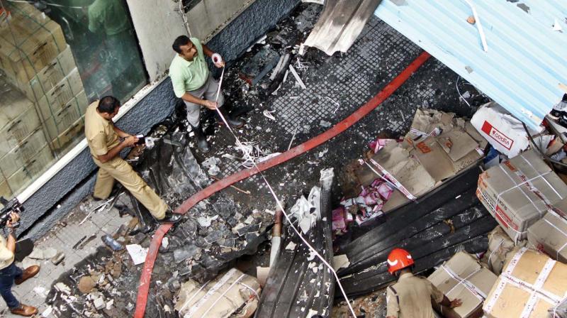 Officials inspect Paragon office-cum-godown building in Kochi on Thursday. (SUNOJ NINAN MATHEW)