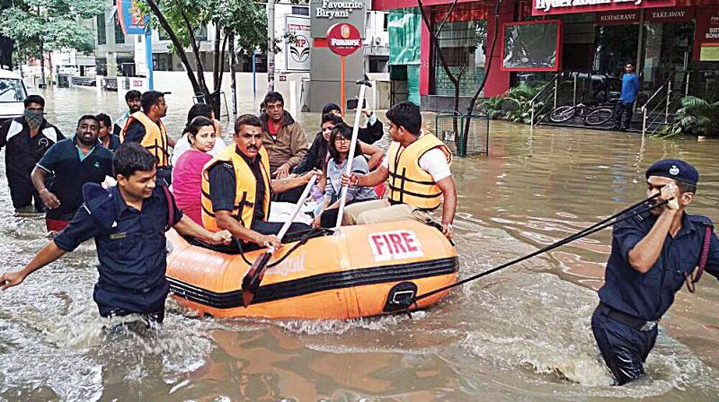 With people stranded, rubber boats were called in to ferry the marooned to safety while fire safety vehicles were seen in the basements of office blocks, pumping out water laced with kerosene that posed a huge fire safety hazard.