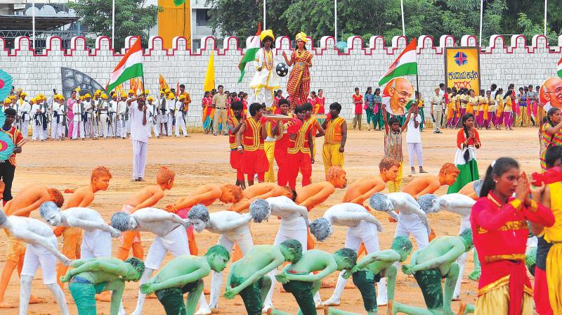 Schoolchildren taking part in the Independence Day celebrations at Manekshaw Parade Grounds in Bengaluru on Tuesday 	 SATISH B.