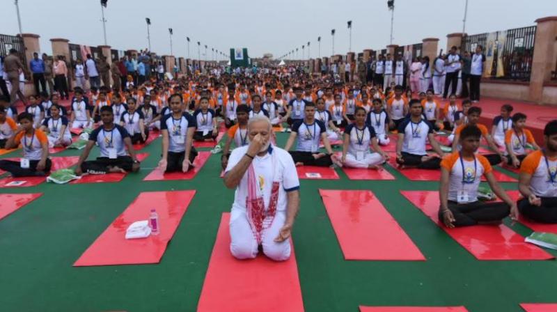 Modi also stressed on the importance of wellness apart from physical fitness and said that Yoga was a medium to achieve wellness. (Photo: Twitter/ PIB)