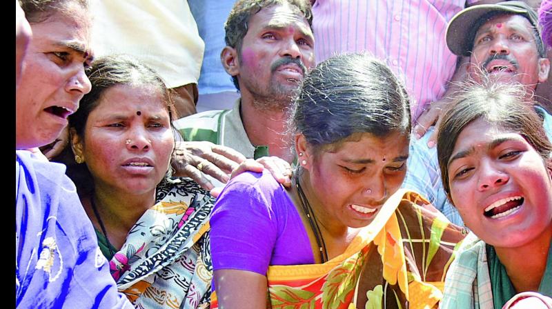 Family members mourn death of the victims who died in the cellar collapse.