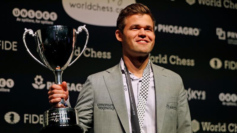 Norwegian Magnus Carlsen won the World Chess Championship for a fourth time on Wednesday after winning three tie-breakers against US rival and world number two Fabiano Caruana. (Photo: AFP)