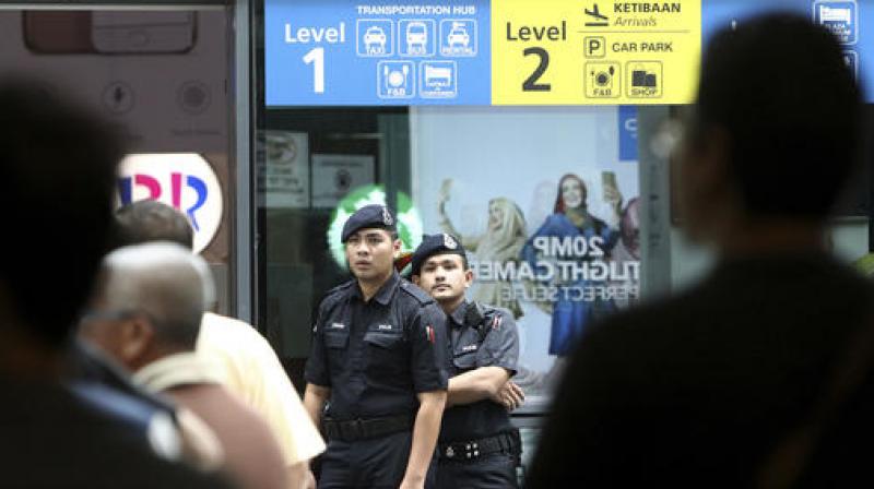 Police officers patrol inside the Kuala Lumpur International Airport in Sepang, Malaysia. (Photo: AP)