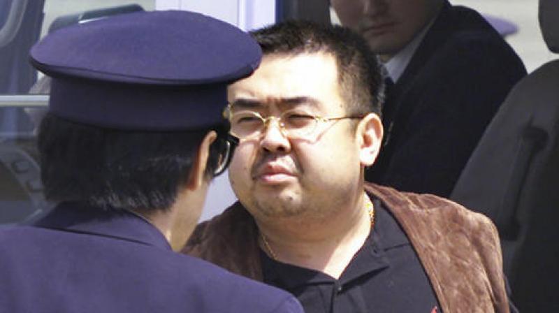 This May 4, 2001, file photo shows Kim Jong Nam, exiled half brother of North Koreas leader Kim Jong Un, escorted by Japanese police officers at the airport in Narita, Japan.  (Photo: AP)