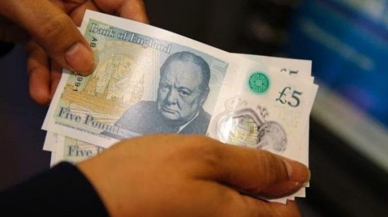 The new Â£5 notes contain tallow, a substance made from animal fat. (Photo: AP)