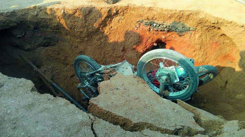 The two-wheeler that fell into a ditch at Safilguda on Saturday morning. (Photo: DC)