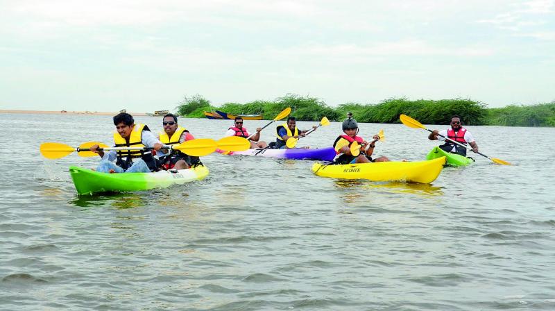 Tourists enjoy the water sports at the Mangamaripeta beach in Visakhapatnam on Saturday. (Photo: DC)