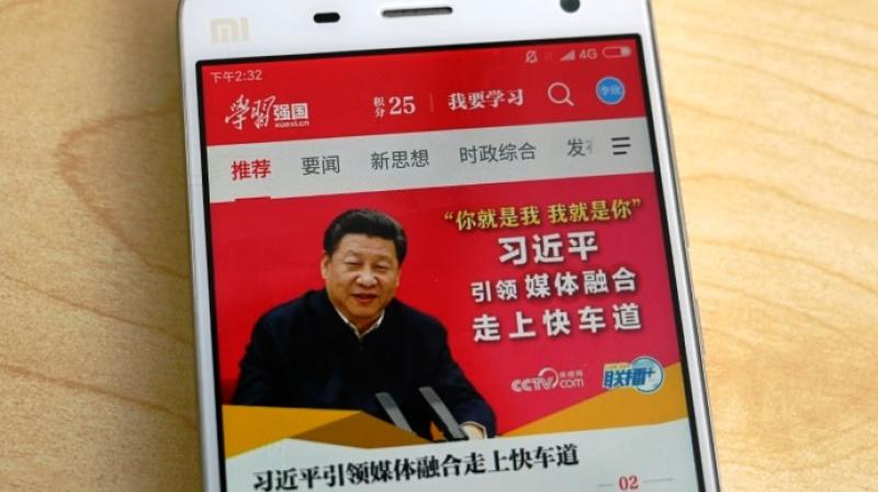 The Study Xi app tracks the amount of time users spend browsing inspirational quotes and following his speeches and travels. (Photo: AFP)