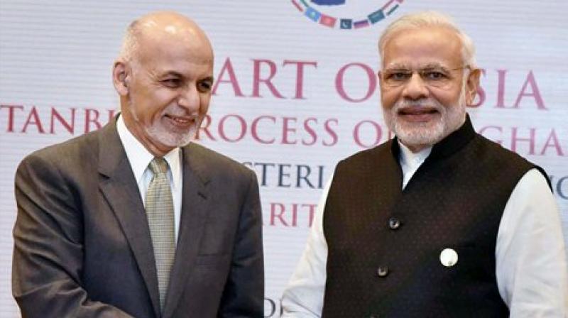 Prime Minister Narendra Modi and Afghan President Ashraf Ghani shake hands during Sixth Heart of Asia Conference in Amritsar on Sunday. (Photo: PTI)