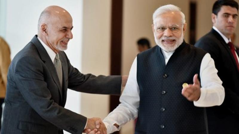Prime Minister Narendra Modi and President of Afghanistan Ashraf Ghani shake hands at 6th Heart of Asia Conference in Amritsar on Sunday. (Photo: PTI)