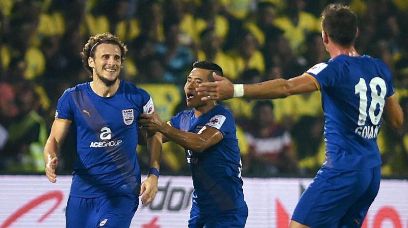 Mumbai City FC captain Diego Forlan celebrates after scoring a goal against Kerala Blasters FC during the Indian Super League. (Photo: AP)