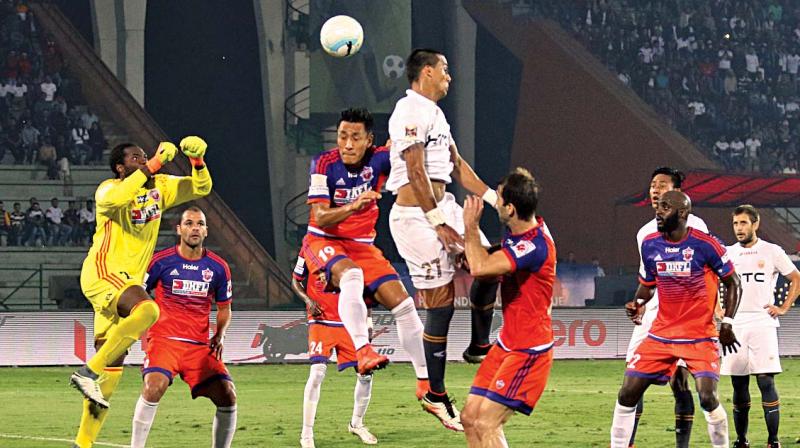 FC Pune City goalkeeper Edel Bete (left) in action against NorthEast United in their ISL-3 match in Guwahati on Tuesday. The hosts won 1-0.