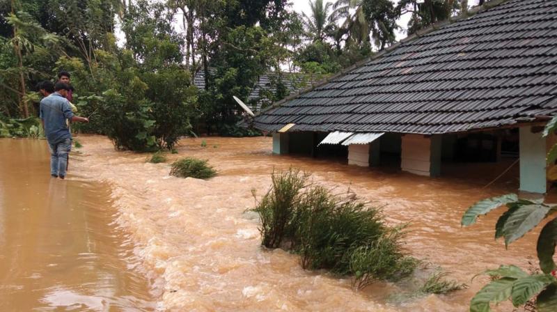 A house at Panthappoyil, downstream Banasurasagar dam, which was submerged in the flash floods that was caused by the sudden opening of the shutters of the dam on Wednesday. (Photo: DC)