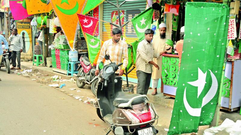Shopkeepers sell decoration materials ahead of Milad-un-Nabi, the birthday of Prophet Mohammed, in the city on Sunday. (Photo: P. Surendra)