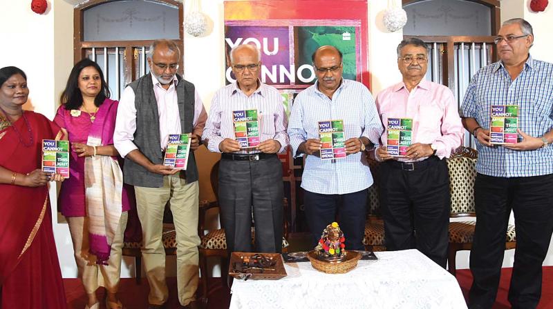 Writer S.L. Bhyrappa releases Capt Gopinaths book, You Cannot Miss This Flight, in Mysuru on Sunday. (Photo: DC)
