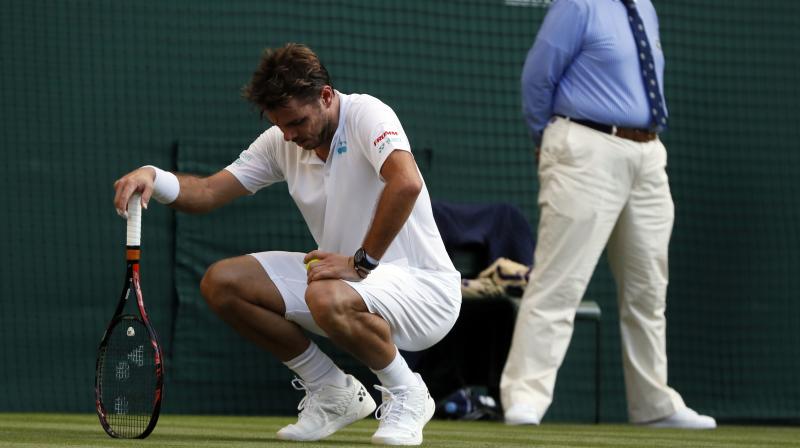 Wawrinka iced his knee during changeovers and never was able to summon his best tennis. (Photo: AP)