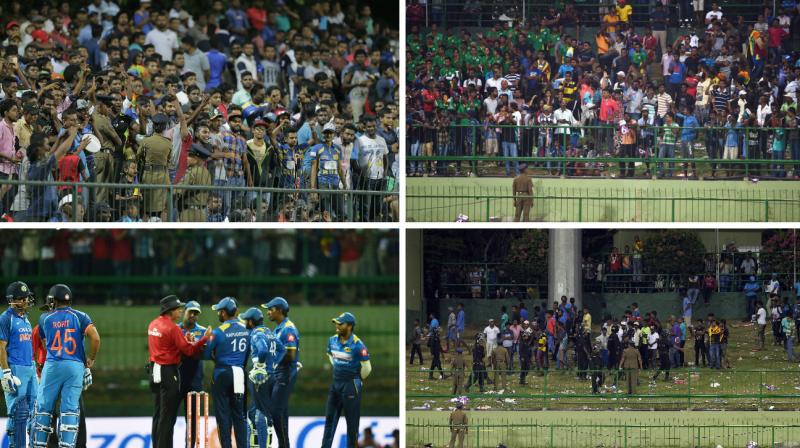 The Indian and Sri Lankan players were sent back into the dressing room, following the rowdy behaviour from Sri Lankan supporters, who resorted to throwing bottles into the field of play. (Photo: AP / PTI)
