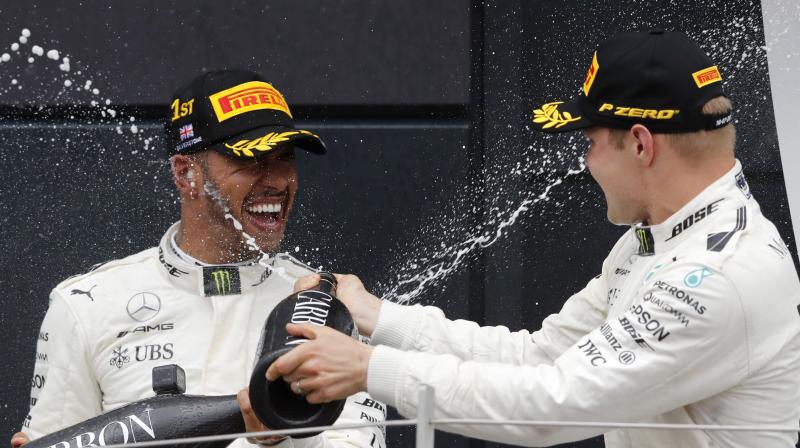 Mercedes team mate Valtteri Bottas finished in second place. Ferraris Kimi Raikkonen finished at the third spot despite suffering tyre issues, followed by Red Bulls Max Verstappen and Daniel Ricciardo.(Photo: AP)