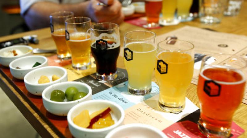In this July 31, 2017 photo, six types of beers with snacks are displayed as it is a popular item on the menu allowing people to enjoy their taste preferences, at Spring Valley Brewery beer restaurant in Tokyo. (Photo: AP)