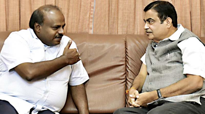 CM H.D. Kumaraswamy in conversation with Union Minister for Road Transport and Highways, Shipping and Water Resources Nitin Gadkari in Bengaluru on Saturday