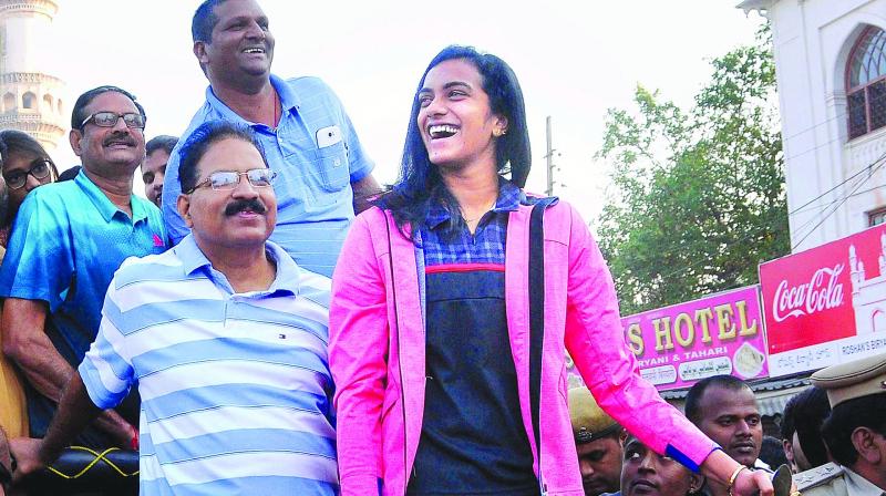 Badminton ace P. V. Sindhu is all smiles at the 5K Run organised around Charminar in Hyderabad on Friday (Photo: AP)