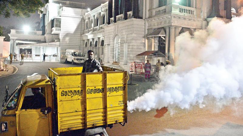 Corporation staff fog secretariat with larvicide a day ahead of the floor test to be conducted in the House on Saturday. (Photo: DC)
