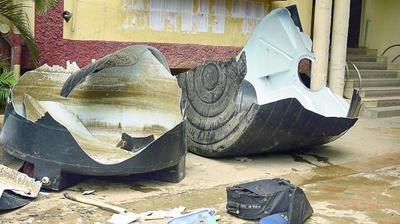 A water tank which was smashed by the students of Narayana Junior College on Wednesday morning. (Photo: DC)