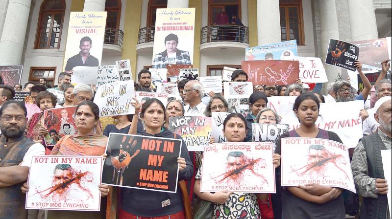 A group of citizens of Bengaluru take part in silent protest against alleged targeted lynchings of Muslims going on country wide, in front of Town Hall on Wednesday 	Shashidhar B