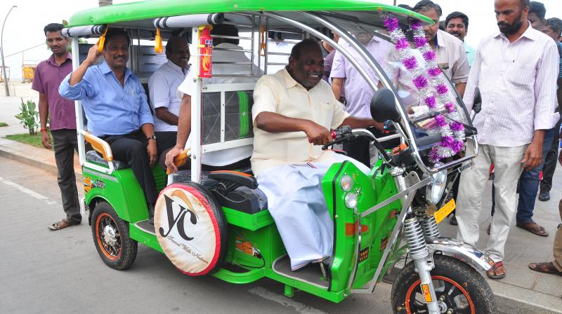 Puducherry welfare minister M. Kandasamy drives the  e-rickshaws after its launch. (Photo: DC)