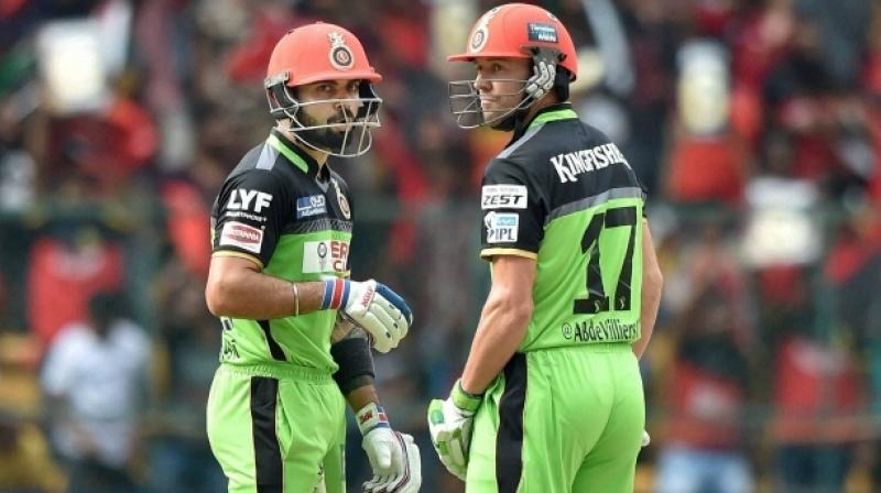This Go Green initiative takes place every season where Kohli gives a small plant to the opposition captain and the names of the players on the jerseys are replaced by their Twitter handles. (Photo: PTI)