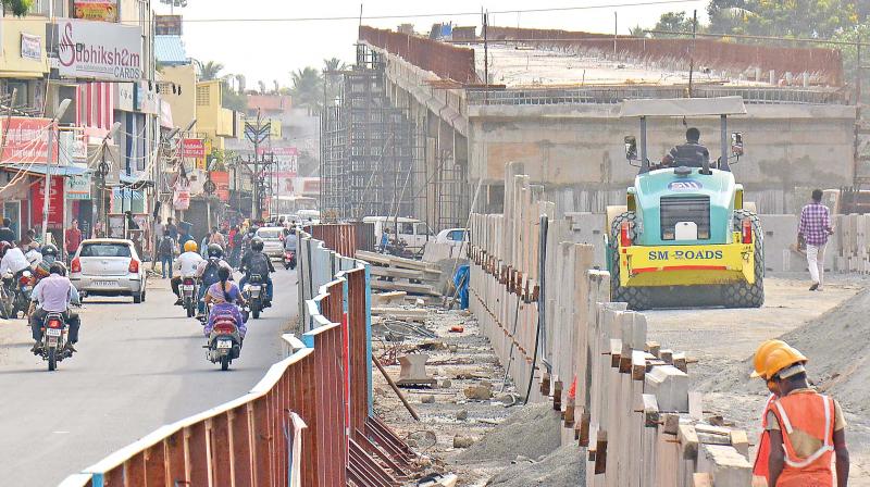 Double-decker bridge work at Velachery-Vijaya Nagar junction is going on at snails pace. (Photo: DC)