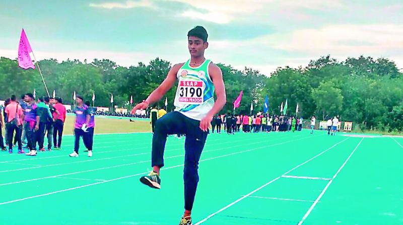 S. Yugender of Telangana leaps during the long jump event of the Boys 12 to 14 years triathlon at the National Junior Athletics Championships that began at the Acharya Nagarjuna University in Manglagiri near Vijayawada on Thursday.