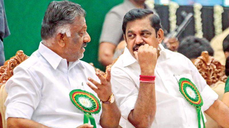 Chief Minister Edappadi K. Palaniswami and Deputy Chief Minister O. Panneerselvam interact at the appointment order presentation ceremony on Tuesday. 556 specialist doctors, 175 junior assistants, 49 typists and 9 steno typists were given appointment orders at the ceremony. (Photo: DC)