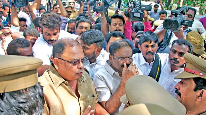 Perambur MLA P. Vetrivel argues with police personnel outside the Poes Garden residence on Wednesday. (Photo: DC)