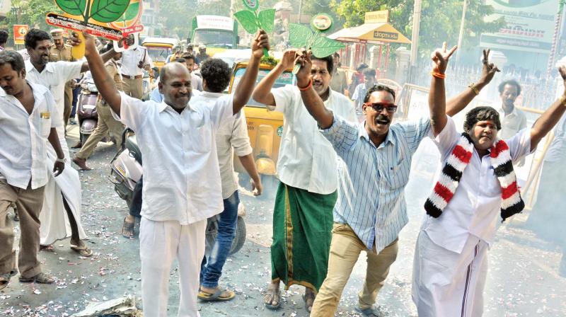 AIADMK cadre celebrate by bursting crackers, distributing sweets and dancing merrily at party office on Thursday after Election Commission allotted the partys Two Leaves symbol to EPS-OPS faction. (Photo: DC)