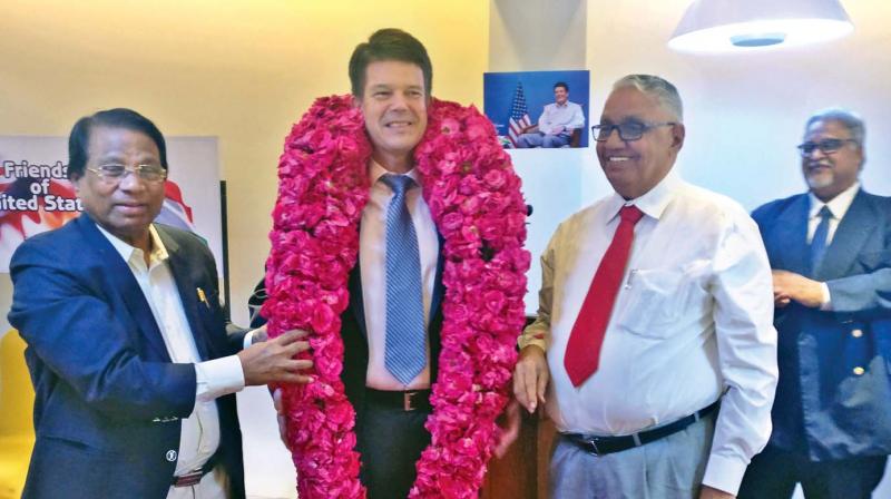 VIT chancellor Dr G. Viswanathan and founder president of Friends of United States, garlands and welcomes the Consul General Robert Burgess at the event in Chennai on Saturday (Photo: DC)