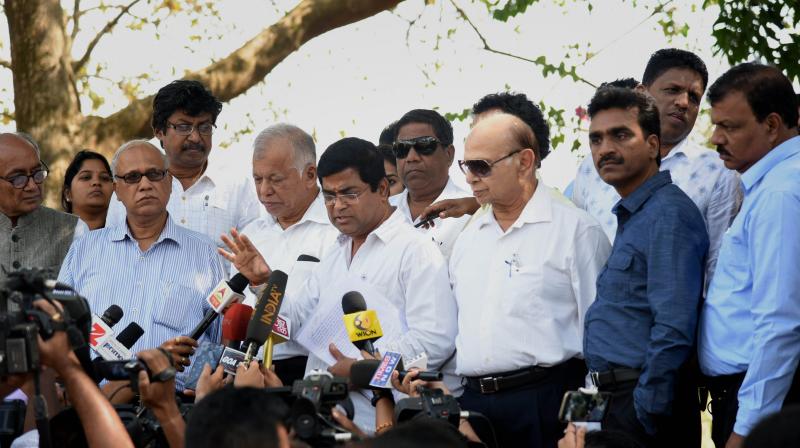 Congress MLAs, accompanied by party General Secretary Digvijay Singh, addressing the media after meeting the Governor Mridula Sinha in Panaji. (Photo: PTI)