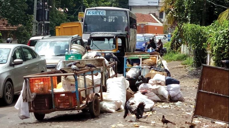 Garbage piled up on the road at Chambakkara.  (Photo: DC)