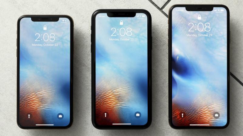 This Monday, October 22, 2018, photo shows from left, the iPhone XS, iPhone XR, and the iPhone XS Max in New York. (AP Photo/Richard Drew)