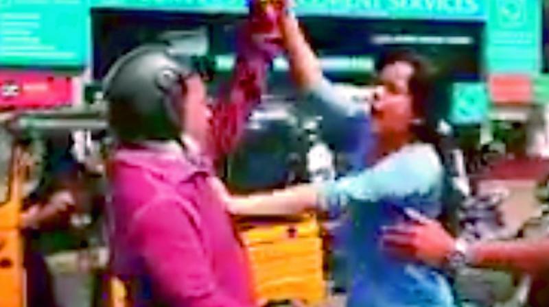 An angry Lubna assaulting a biker in Begumpet on Thursday.